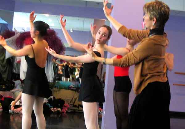 Sophomore Emma Robertson, middle, and classmates learn a routine at Legacy School of the Arts on April 22. Robertson was not actually in the routine they practiced, she filled in for missing students.