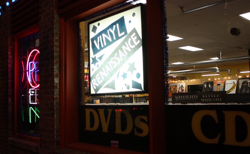 The Vinyl Renaissance sign lights up the window in the 39th Street location Dec.4. 