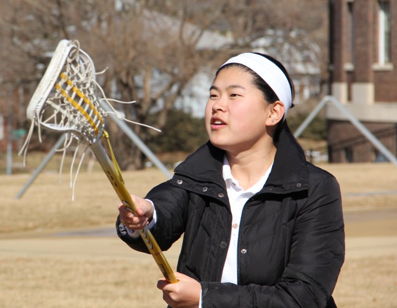 Senior Molly Woolery keeps her eyes on the ball during an informal practice Feb. 18. Woolery is one of two STA lacrosse players who will be the first to play lacrosse in college. 