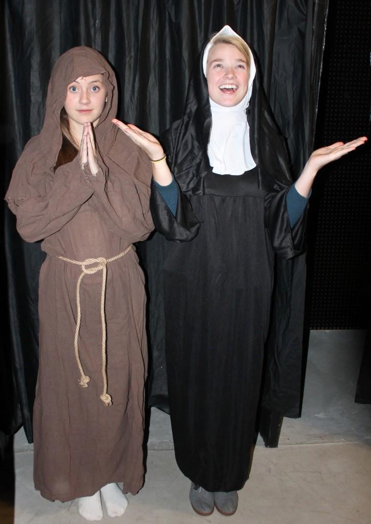 From left seniors Natalie Rall and Kelly Gardella are dressed up in a monk costume and a sister costume at Halloween City.