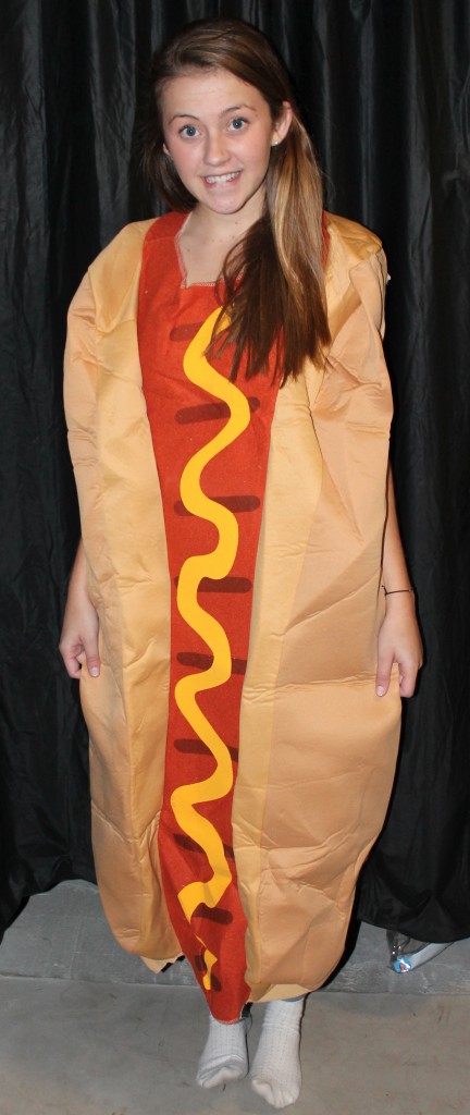 Senior, Natalie Rall tries on a hotdog costume at Halloween City.