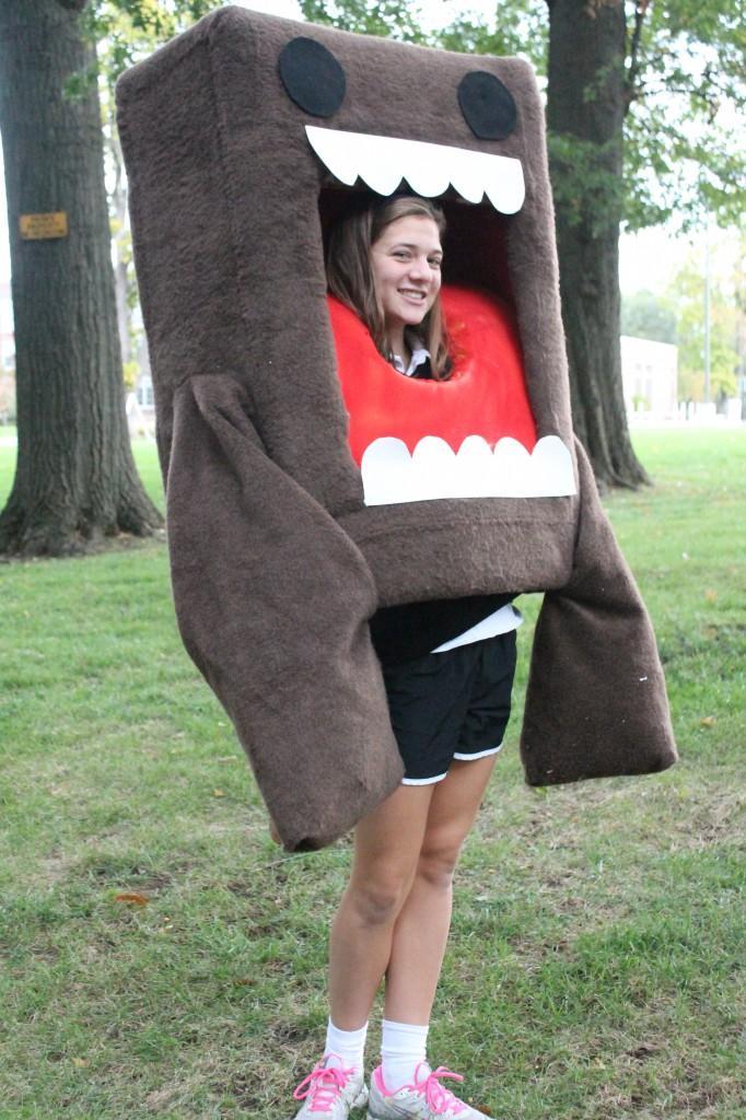 Junior Elaine Kerr stands tall in her favorite costume of Domo. Domo is the official of a Japan television station. 