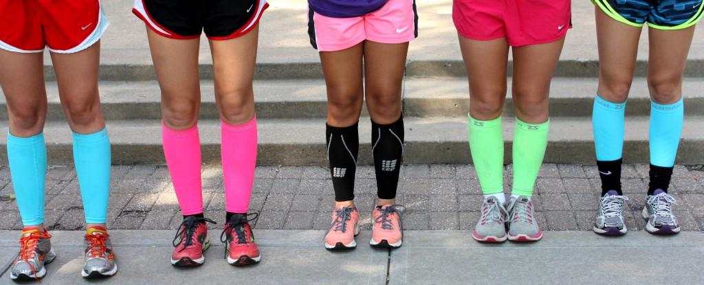 Junior Anna Bauman, from left,  freshmen Meg Duffey, freshmen Catherine Parra sophomore Mary Hillard and sophomore Meghan Brownlee wear compresion sleeves on their legs to help with their shin splints. The sleeves, created by Zensah, are used to prevent and reduce the pain of shin splints, but also support calf muscles.
