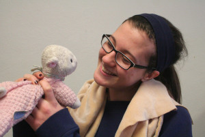 Sophomore Siena Hutchison looks at the lamb that she sleeps with at night.