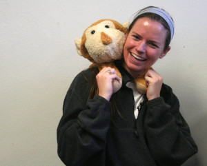 Senior Grace Wells poses with a stuffed monkey she has had since childhood.