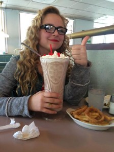 Sophomore Mackenzie O'Guin poses by the infamous Winstead's Skyscraper. Unknown to most, the secret ingredient in said milkshake is undiluted self-loathing.